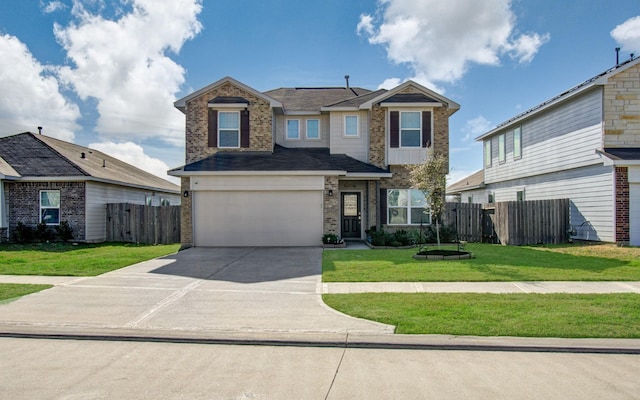 view of front of house with a garage and a front lawn