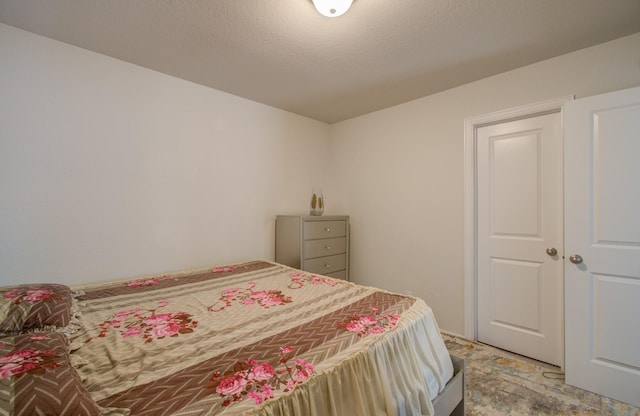 bedroom featuring a textured ceiling