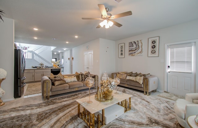 living room featuring ceiling fan and light colored carpet