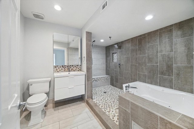 full bathroom with tile patterned flooring, vanity, toilet, and independent shower and bath