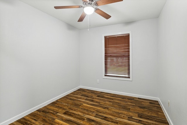 unfurnished room featuring ceiling fan and dark wood-type flooring