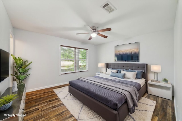 bedroom featuring ceiling fan and dark hardwood / wood-style flooring