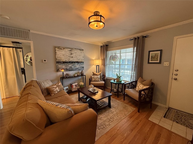 living room featuring hardwood / wood-style floors and crown molding