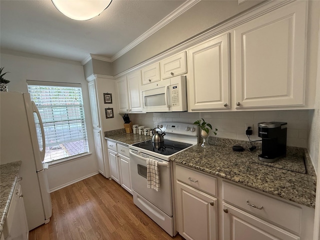 kitchen with light wood-type flooring, backsplash, ornamental molding, white appliances, and white cabinets