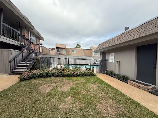 view of yard with a community pool