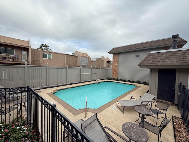 view of swimming pool featuring a patio