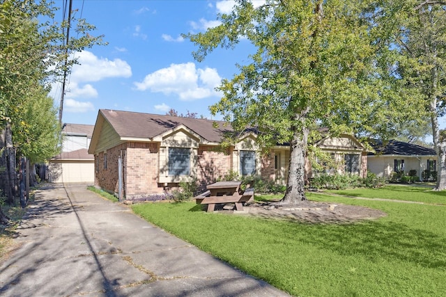 single story home featuring a garage and a front lawn