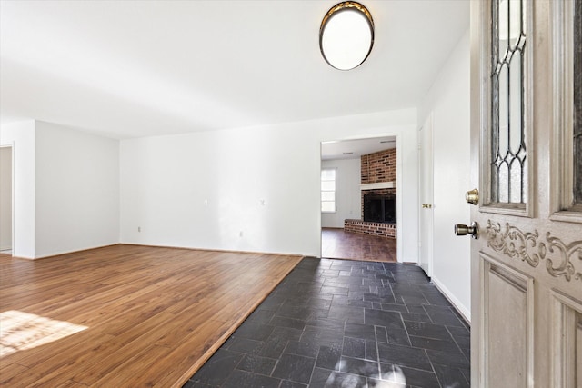 entrance foyer featuring a fireplace