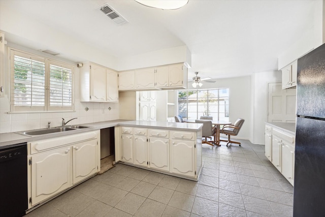 kitchen featuring ceiling fan, sink, tasteful backsplash, kitchen peninsula, and black appliances