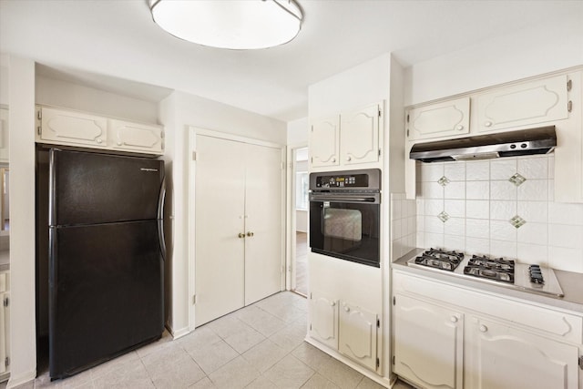 kitchen with white cabinets, light tile patterned floors, backsplash, and black appliances