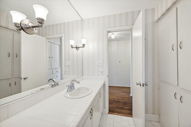 bathroom featuring tile patterned floors and vanity