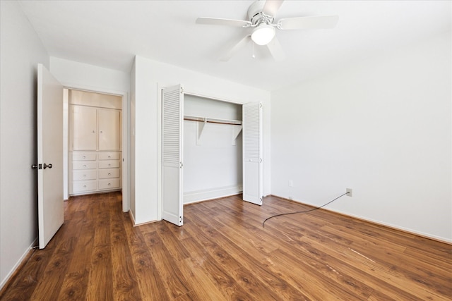 unfurnished bedroom with ceiling fan, a closet, and dark wood-type flooring