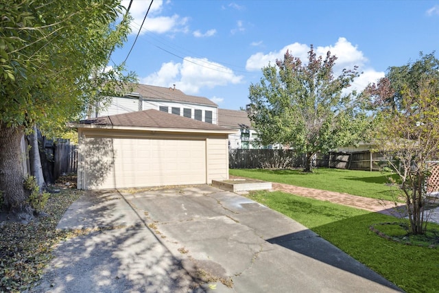 exterior space featuring a garage and a front lawn