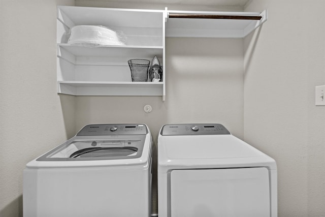 laundry area with washing machine and dryer