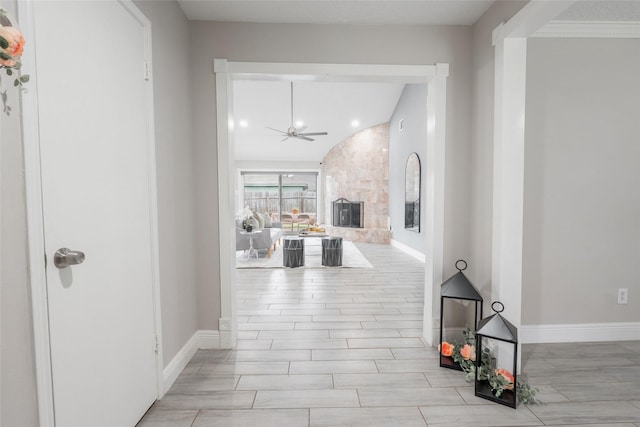 hallway with lofted ceiling