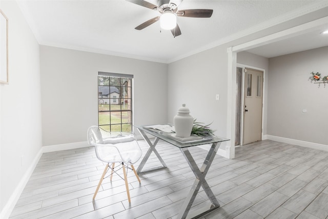 unfurnished office with ceiling fan and ornamental molding