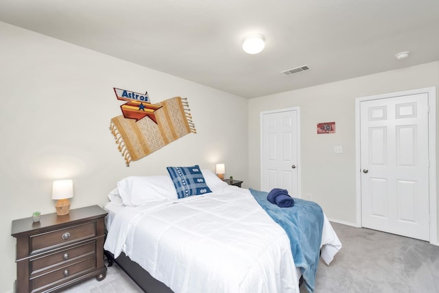 bedroom with light colored carpet