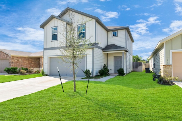 view of front of home featuring a front yard and a garage