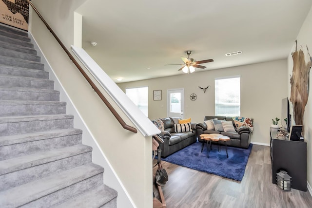 living room with hardwood / wood-style floors and ceiling fan