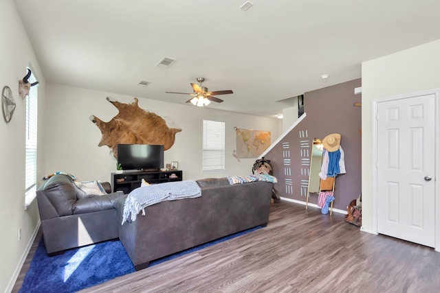 living room with ceiling fan and wood-type flooring