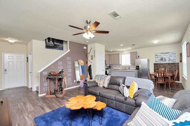 living room with ceiling fan and wood-type flooring