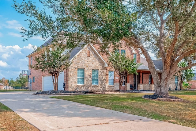 view of front of property featuring a garage and a front lawn