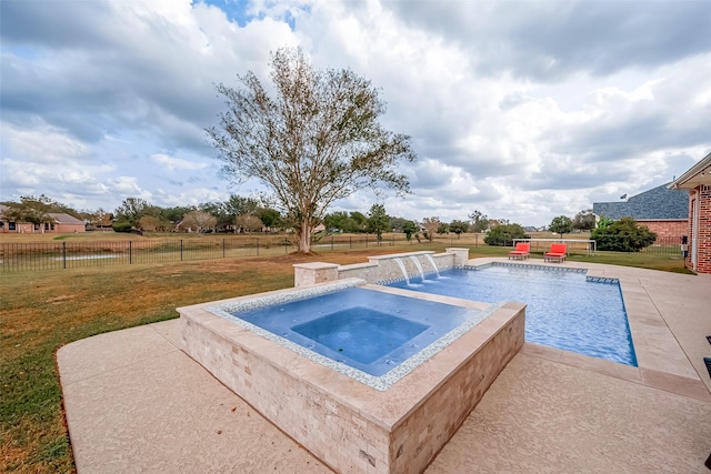 view of swimming pool featuring pool water feature, a patio, an in ground hot tub, and a lawn