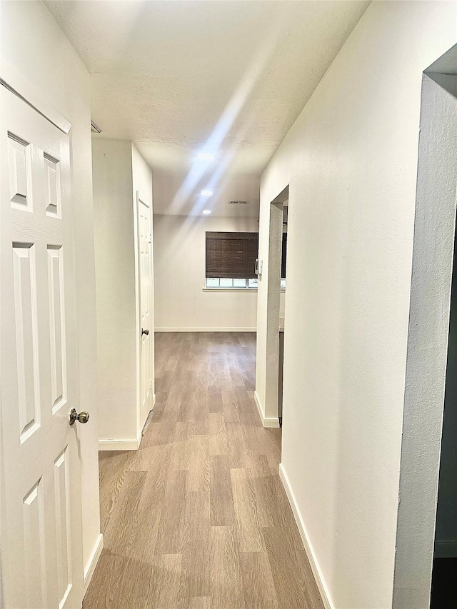 hall featuring light hardwood / wood-style flooring