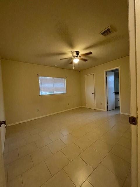 unfurnished room with ceiling fan