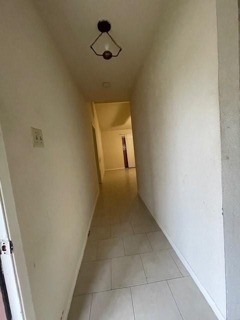 hallway with light tile patterned flooring