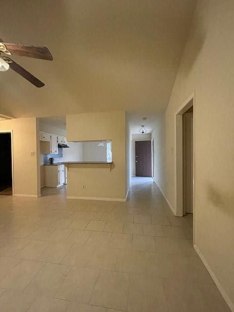 unfurnished living room featuring ceiling fan, light tile patterned flooring, and lofted ceiling