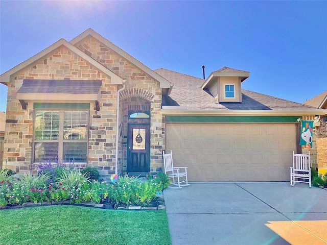 view of front of property with a garage