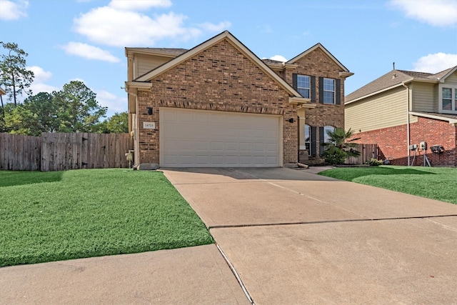 view of front of property with a front yard and a garage