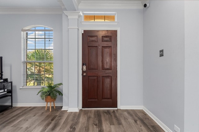 foyer featuring hardwood / wood-style floors and ornamental molding