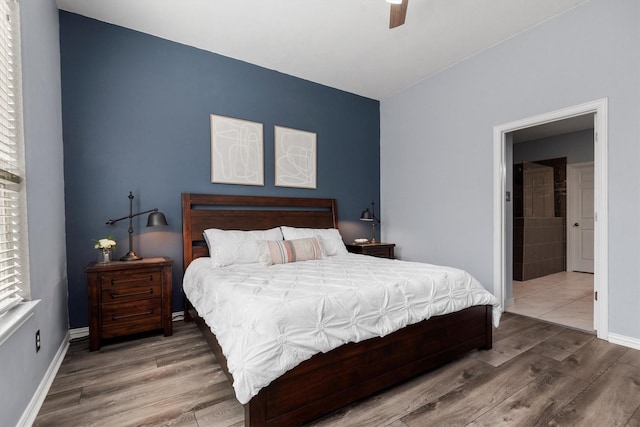 bedroom with hardwood / wood-style flooring and ceiling fan