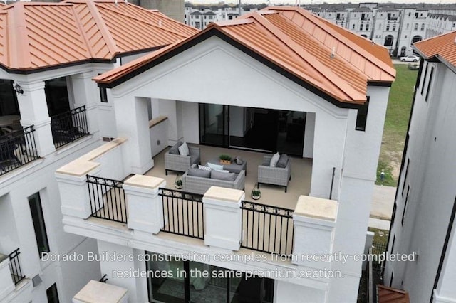 exterior space with outdoor lounge area and a balcony