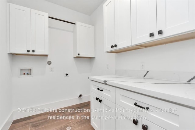 laundry room with cabinets, washer hookup, and hookup for an electric dryer