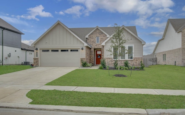 craftsman-style house featuring central AC, a garage, and a front lawn