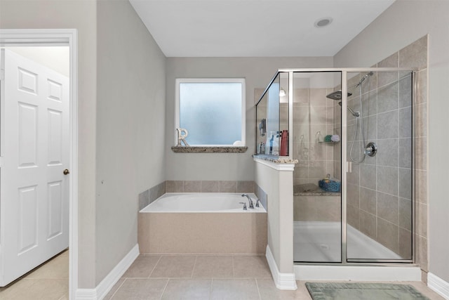 bathroom featuring tile patterned flooring and plus walk in shower