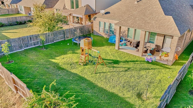 exterior space with a playground, an outdoor living space, a patio, and a trampoline