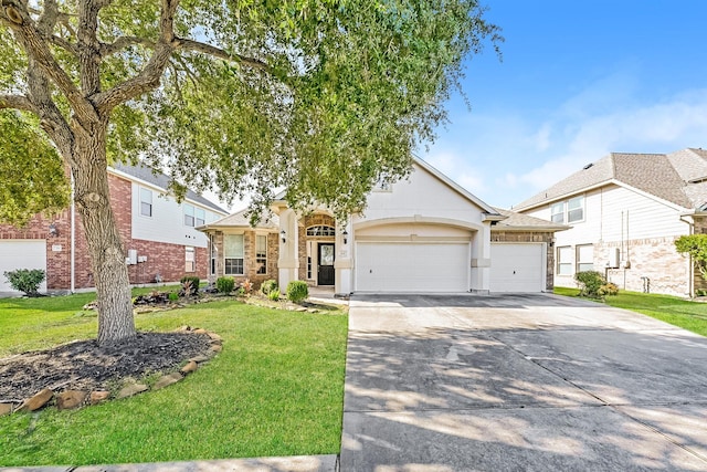 view of front of property featuring a garage and a front yard