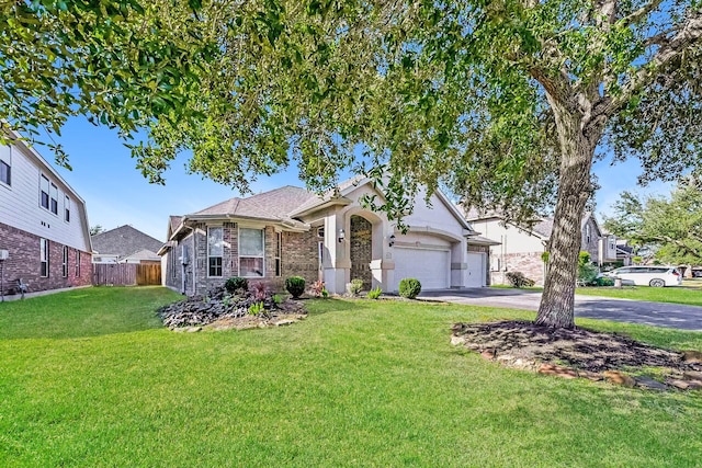 view of front of house featuring a garage and a front lawn