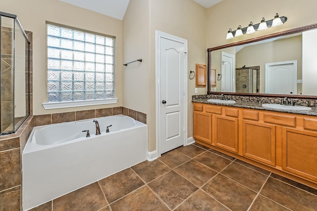 bathroom with separate shower and tub, tile patterned floors, and vanity