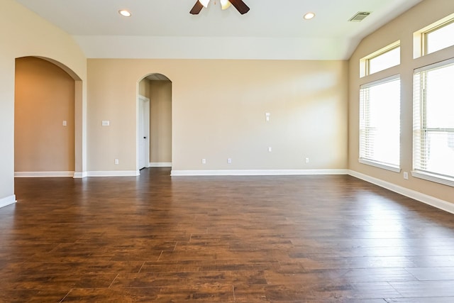 unfurnished room featuring ceiling fan, dark hardwood / wood-style flooring, and lofted ceiling