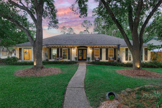 view of front of home with a yard