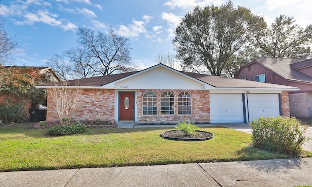 ranch-style home with a front lawn and a garage