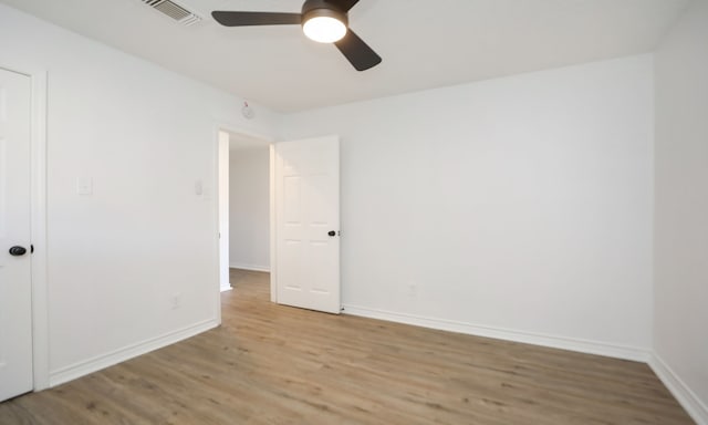 empty room featuring ceiling fan and light wood-type flooring