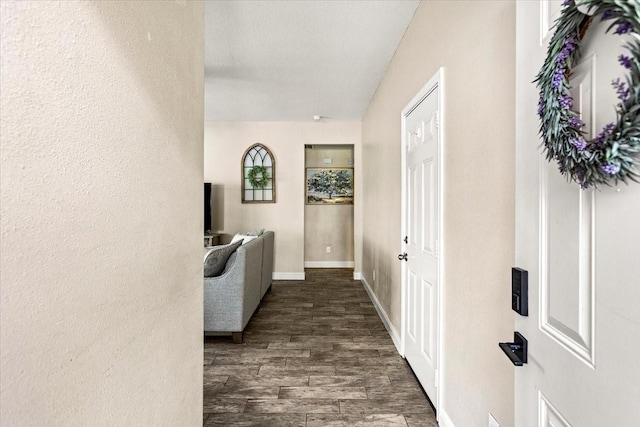 corridor with dark wood-type flooring