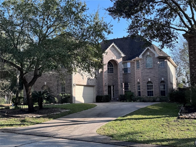 view of front of house featuring a front yard and a garage