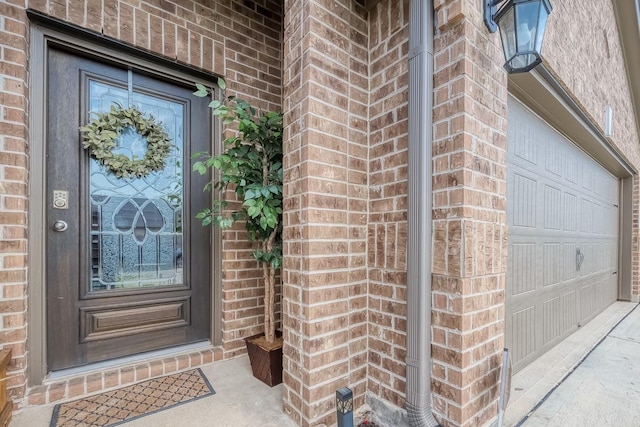 view of exterior entry featuring a garage